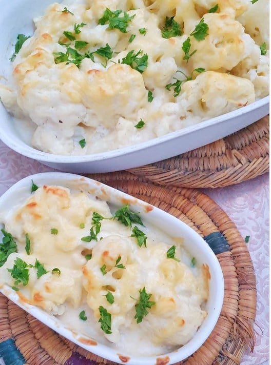picture of 2 oven dishes with cauliflower cheesy bake