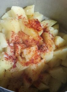Season potatoes paprika