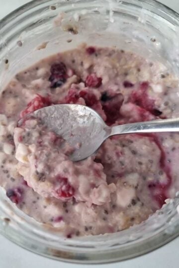 High protein cottage cheese overnight oats in a jar with spoon.